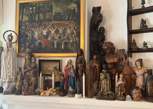 Hand-carved antique wooden religious figurines displaying traditional devotional craftsmanship