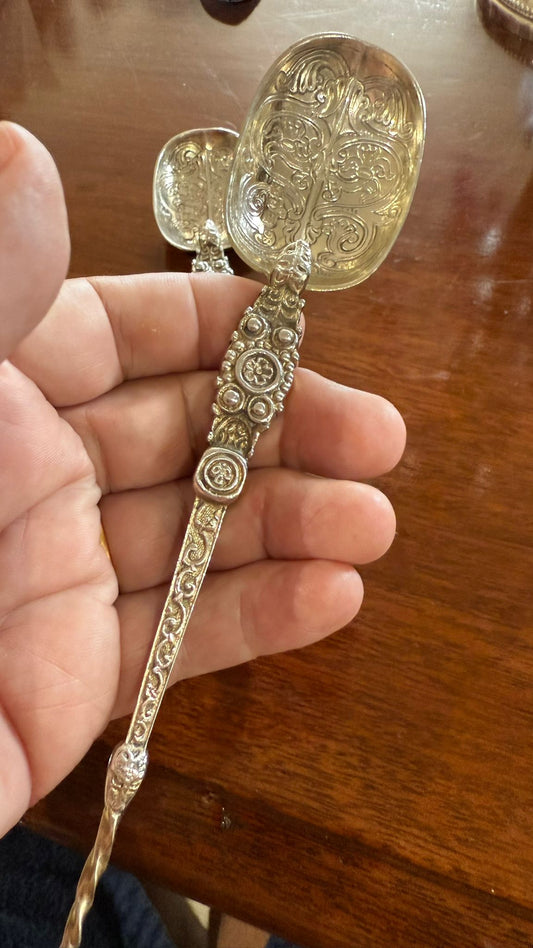 Pair of very ornate silver plated spoons